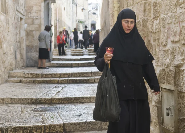 stock image Nun holds candle