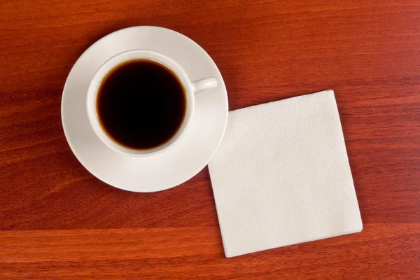 Cup of coffee and napkin — Stock Photo, Image