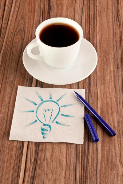 Light bulb on a napkin — Stock Photo, Image