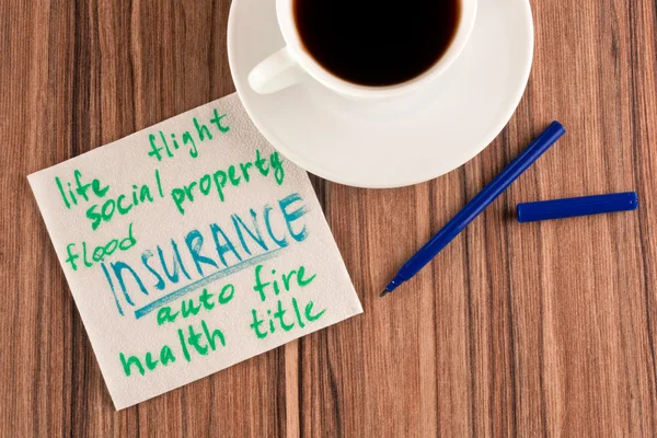 Insurance on a napkin — Stock Photo, Image