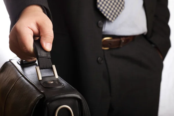 Holding a briefcase in hand — Stock Photo, Image