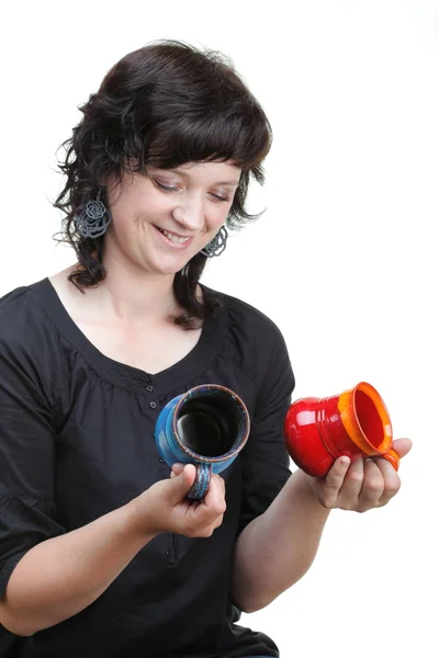 Woman holding a red and blue cup, isolated — Stock Photo, Image