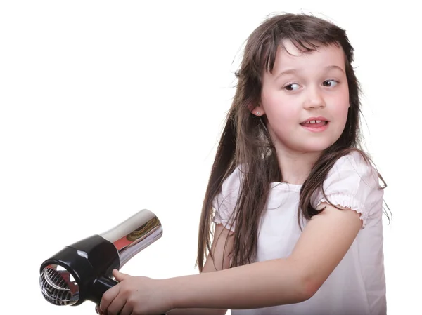 Kis lány pózol, hajszárítóval felszerelt — Stock Fotó