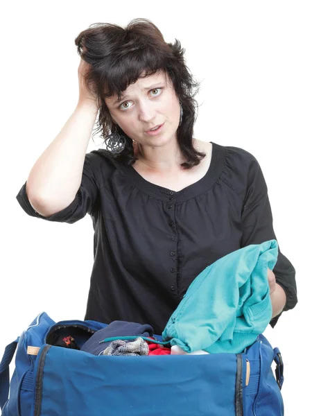 Woman crammed full of clothes and shoulder bag isolated — Stock Photo, Image