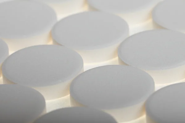 Blanco grandes píldoras fondo —  Fotos de Stock
