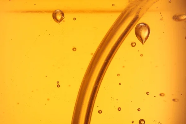 Soap bubbles orange liquid