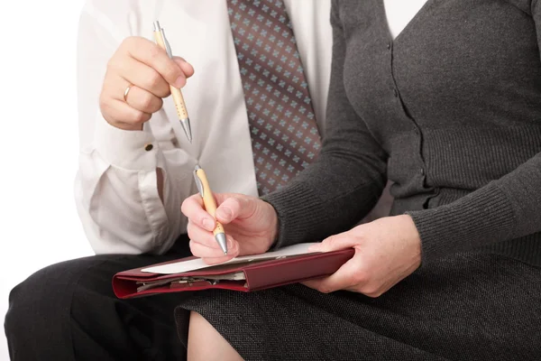 Vrouw en man schrijven pen op papier geïsoleerd — Stockfoto