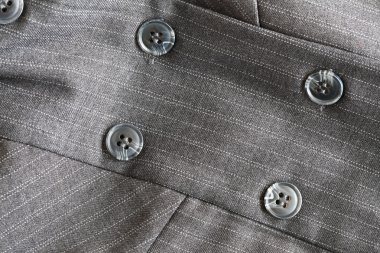 Button on a gray suit clipart