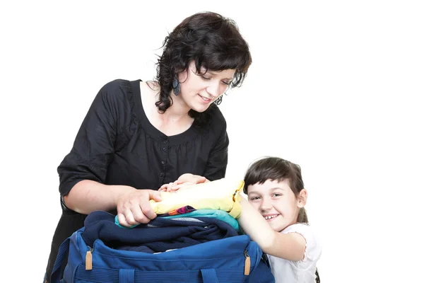 Woman and daughter hand crammed full of clothes and shoulder bag — Stock Photo, Image