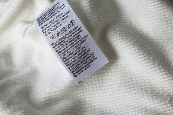 Macro de etiqueta de ropa blanca — Foto de Stock