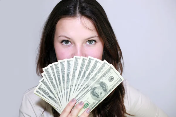 En flicka med pengar — Stockfoto