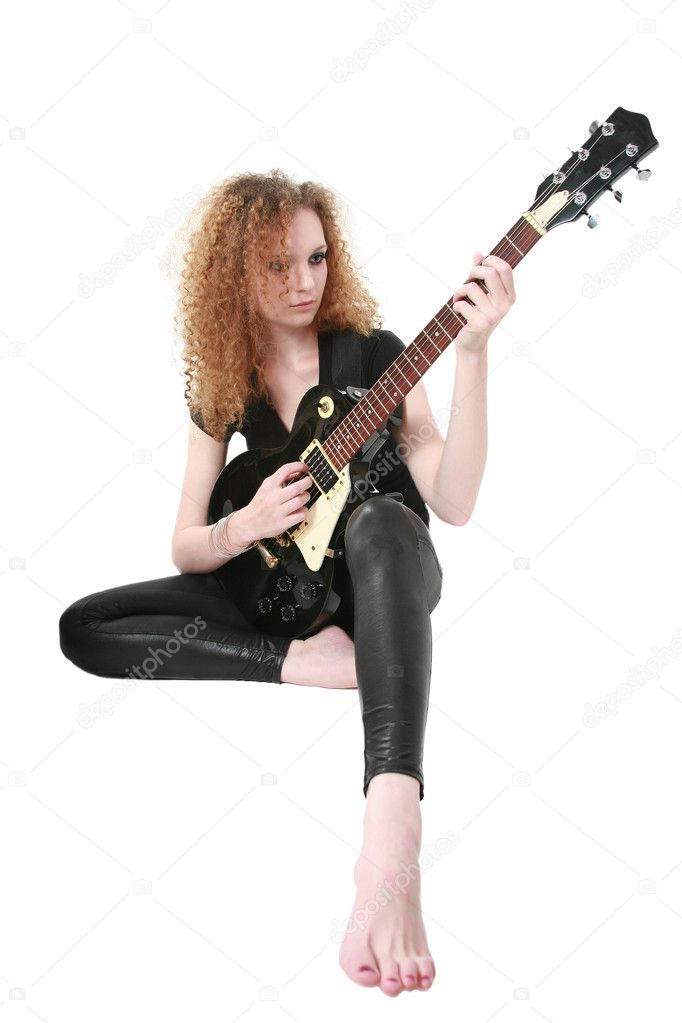 Curly-haired girl playing guitar