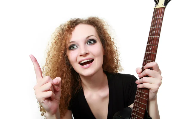 Redhead curly girl with a guitar — Stock Photo, Image