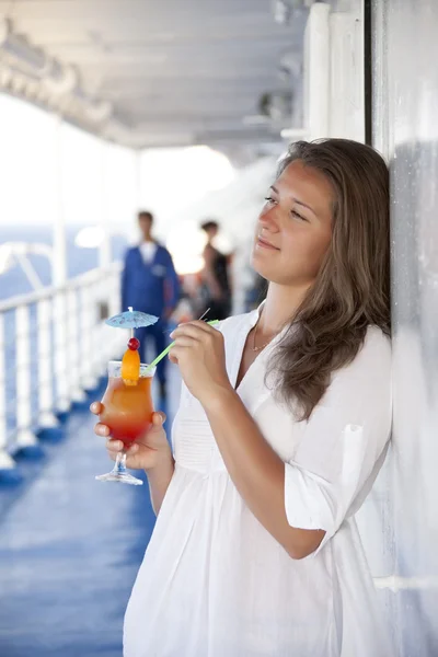 Girl with a cocktail on the deck of dreams — Stock Photo, Image