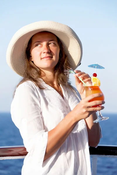 Woman enjoying a cocktail hat on the liner — Stock Photo, Image