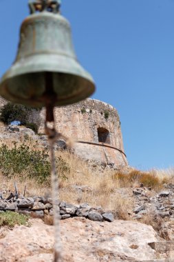 The bell tower on the background of the old