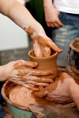 Potters make a pot clipart