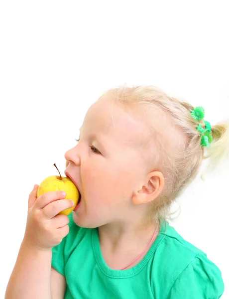 Portrait of a girl biting an apple — Stock Photo, Image
