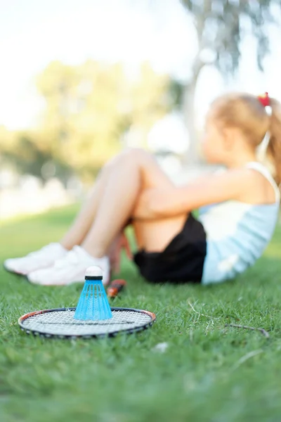 Girl with a set of badminton in the park — Stock Photo, Image