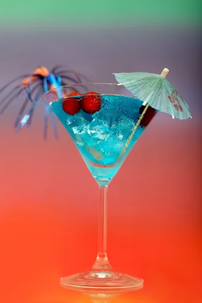 Cocktail with ice and umbrella — Stock Photo, Image
