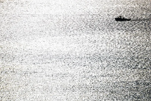 Silhouette of One Boat on Gleaming Sea. — Stock Photo, Image