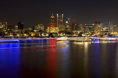 Boat Light Trails Along Willamette River in Portland Oregon clipart