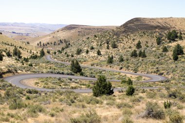 Winding Highway in Oregon High Desert Farmland clipart