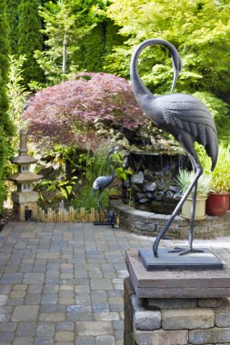Bronze Cranes in Japanese Inspired Garden clipart