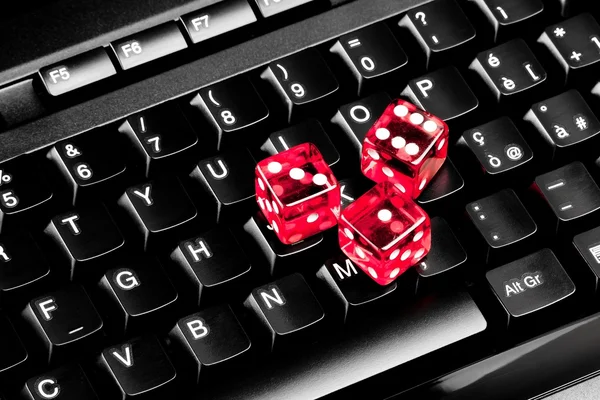 Playing dice on computer keyboard — Stock Photo, Image