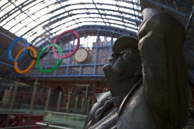 John Betjeman Statue and Olympic Rings at St Pancras clipart