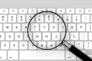 Magnifier with keyboard clipart