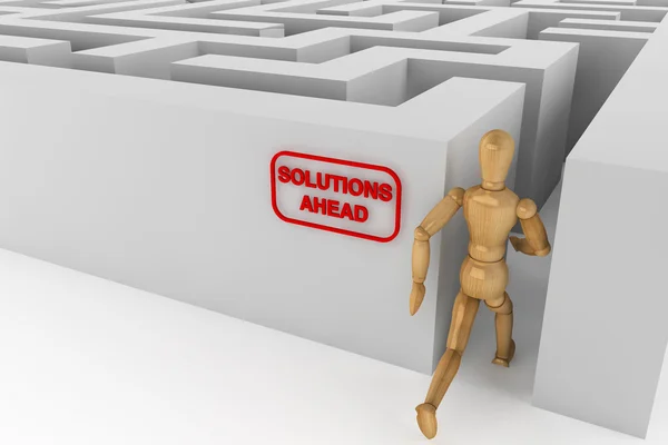 Wooden dummy runing to solution in labyrinth — Stock Photo, Image