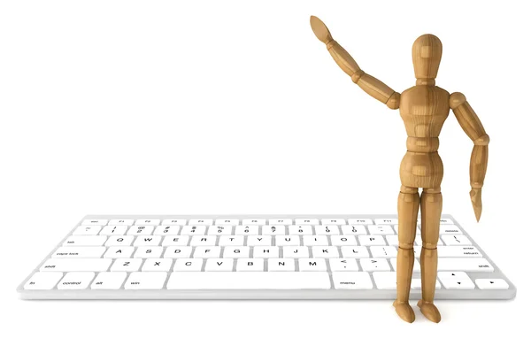 Wooden dummy with computer keyboard — Stock Photo, Image