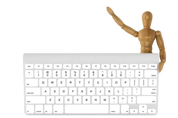 Wooden dummy with computer keyboard — Stock Photo, Image