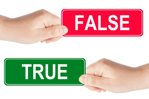 stock image True and False traffic sign in the hand