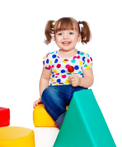 Beautiful little girl playing in the constructor — Stock Photo, Image