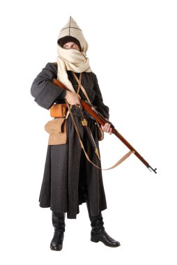 Man in vintage costume of Russian Cossack with rifle. clipart