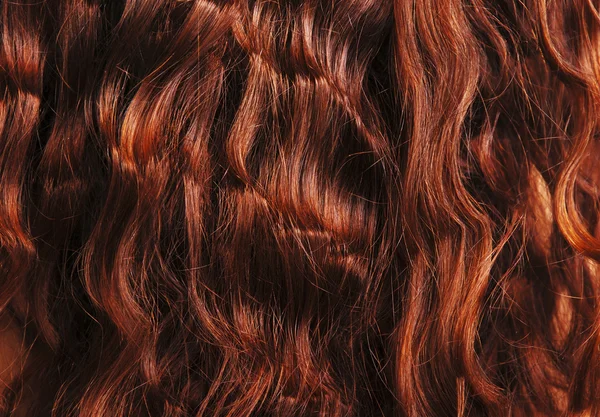 Kırmızı kıvırcık saç yakın çekim — Stok fotoğraf