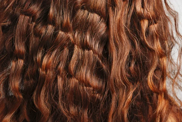 Крупный план рыжих кудрявых волос — стоковое фото