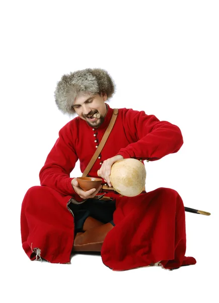 Tatar warrior pouring out calabash. — Stock Photo, Image