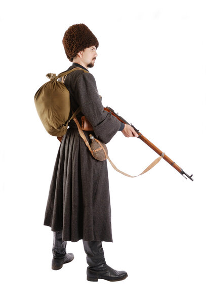 Side view of Russian Cossack with a gun.