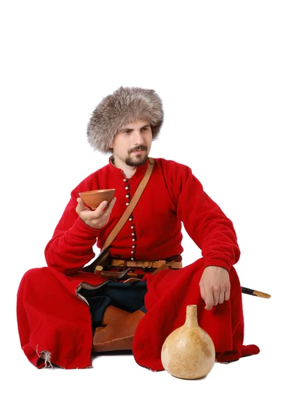 Wojownik tatarski siedzi z filiżanki i tykwa. — Zdjęcie stockowe