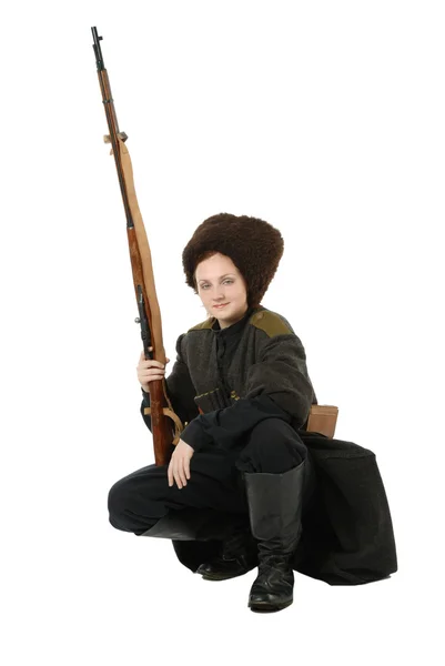 Russian Cossack smiling with rifle in squatting position. — Stock Photo, Image
