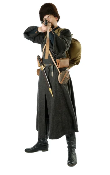 Man in vintage costume of Russian Cossack points a rifle. — Stock Photo, Image
