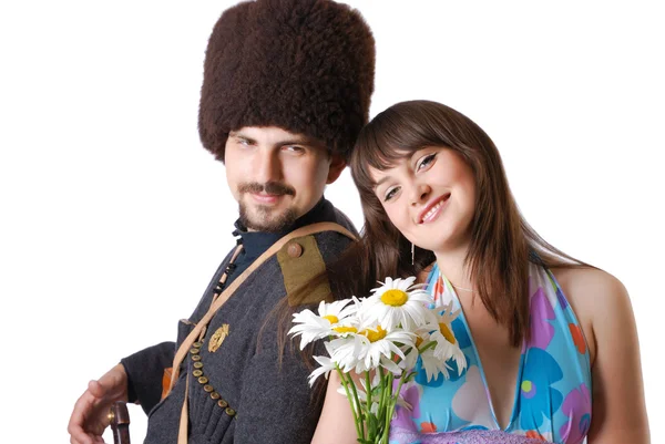 Jovem no exército e sua namorada com flores . Fotografias De Stock Royalty-Free