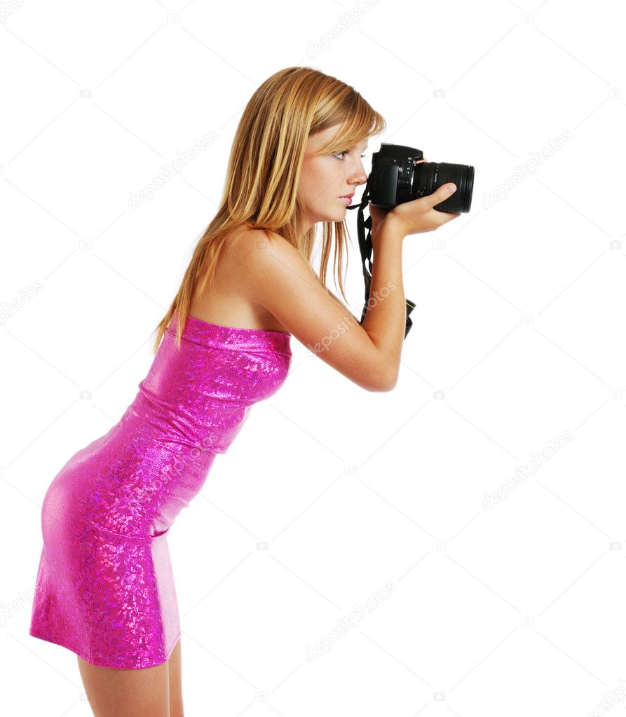Side view of a blonde photographing