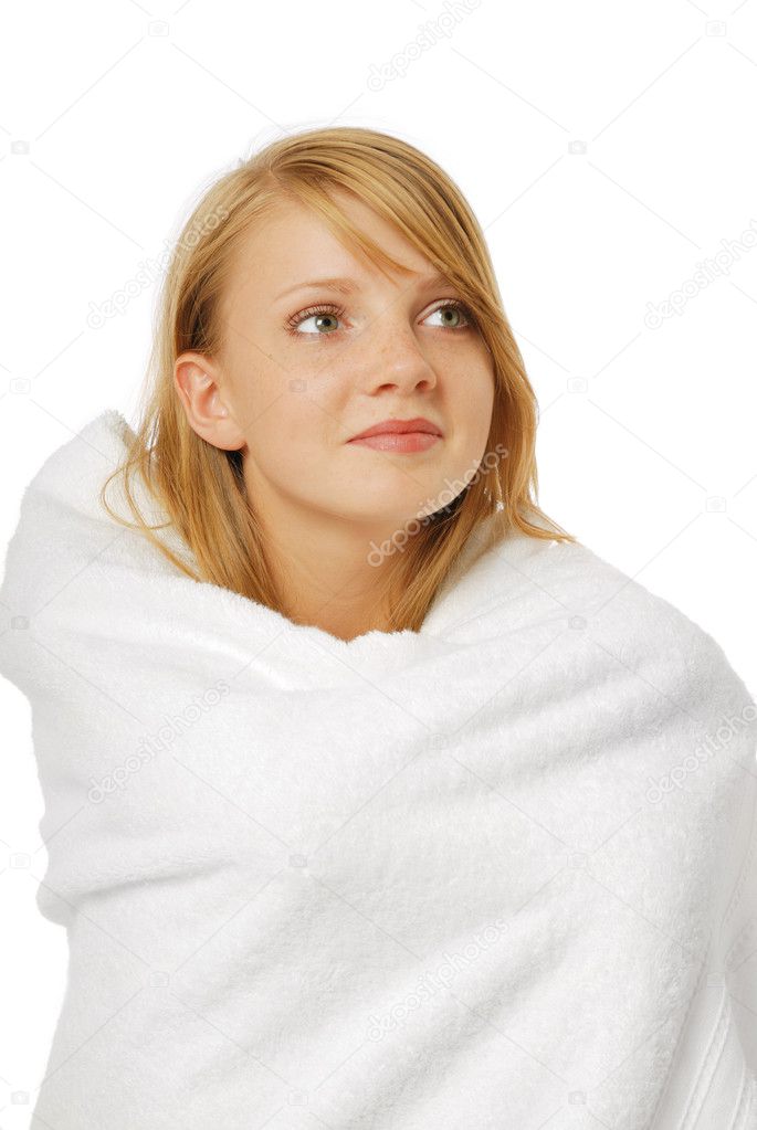 Close-up of a happy girl in a bath towel