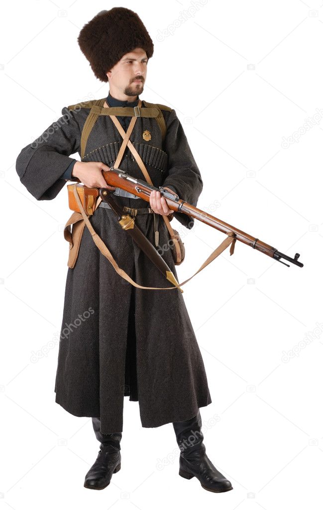Man in vintage costume of Russian Cossack with a rifle.