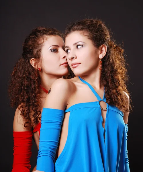 Pretty twins whispering — Stock Photo, Image
