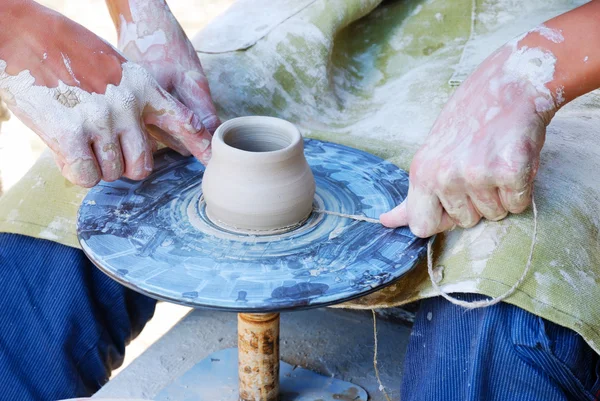 Potters working by the throwing wheel — Stock Photo, Image